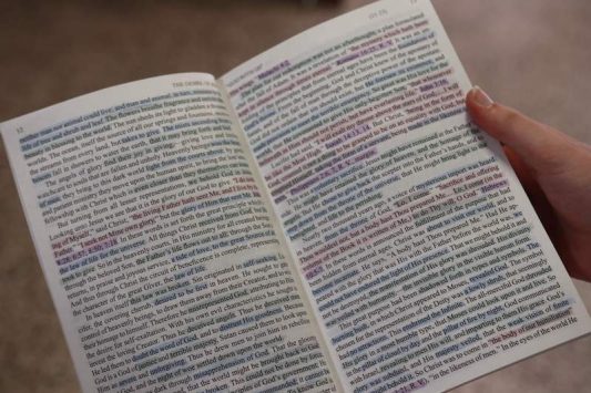 A sophomore holds her marked copy of the Desire of Ages.