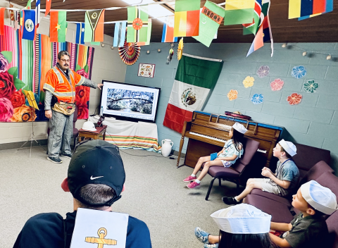 Tim Castanon shares a few words to a captive audience at the Charlotte VBS. 