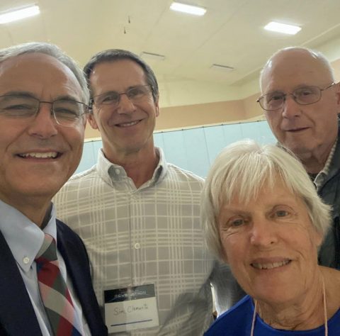 Jim Micheff takes a selfie with members of the Charlotte church. He visited churches throughout the series.